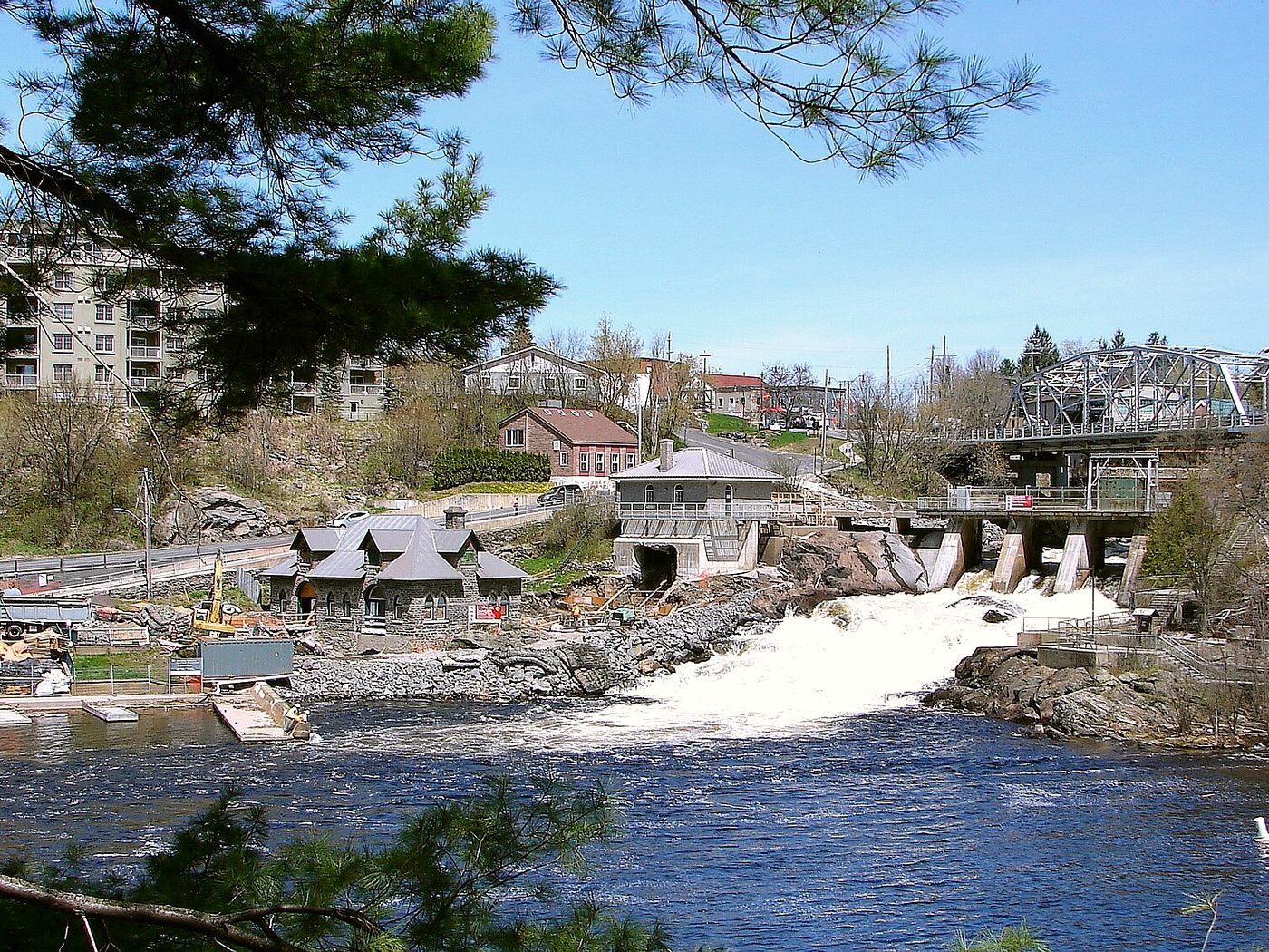 Bracebridge Falls on the Muskoka River with downtown Bracebridge buildings on the hill above