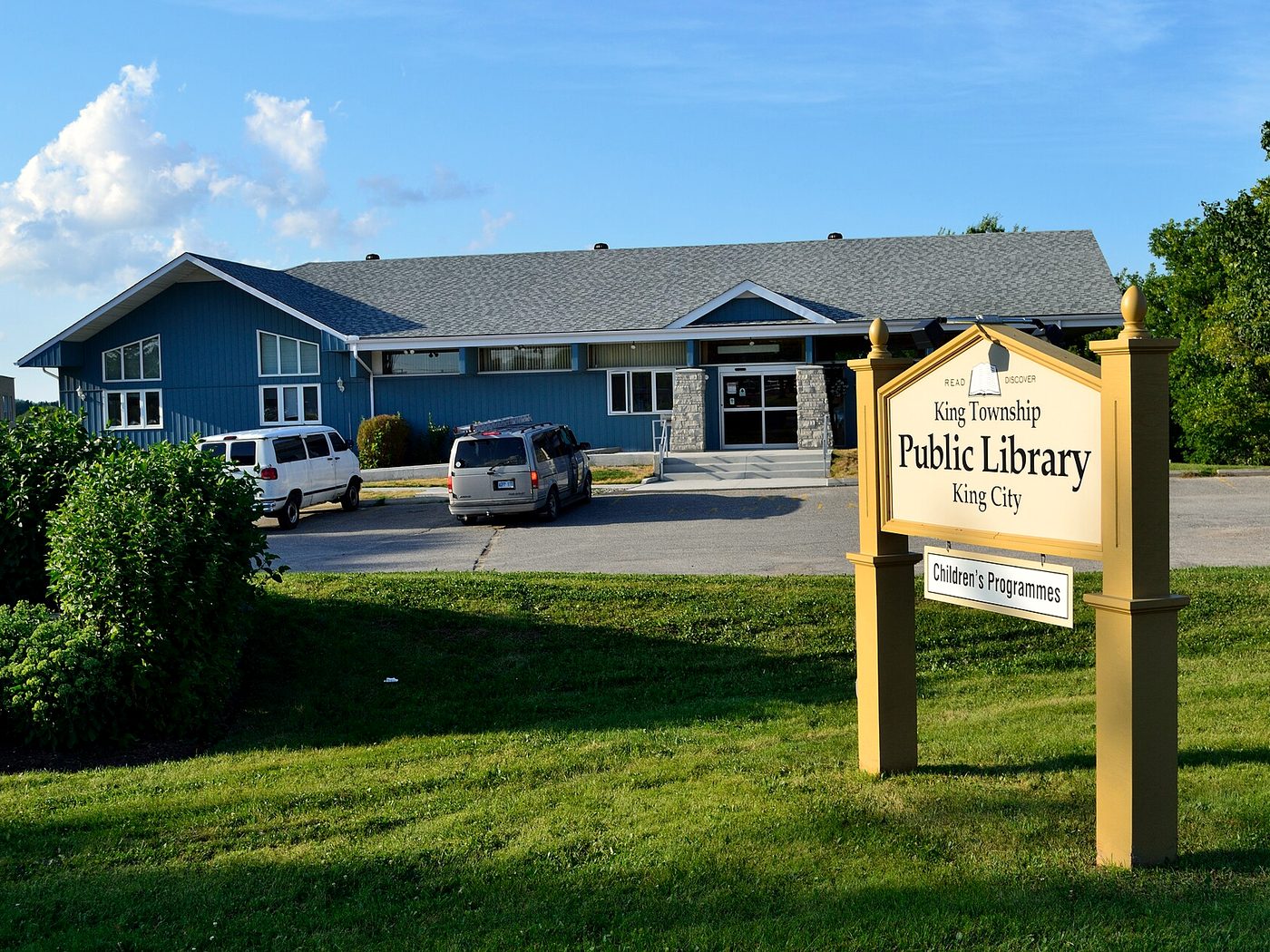 The King Township Public Library building and sign on King Road in King City